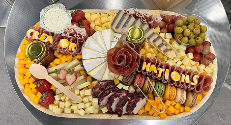 Creator Nations grazing board spelling out the name in charcuterie.